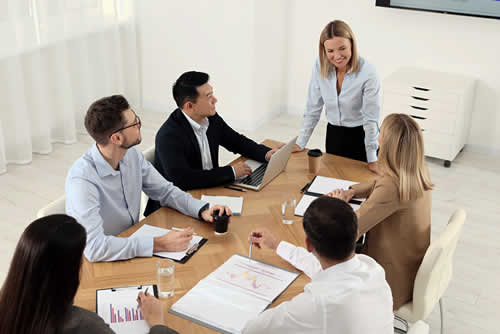 A supervisor leading a team meeting