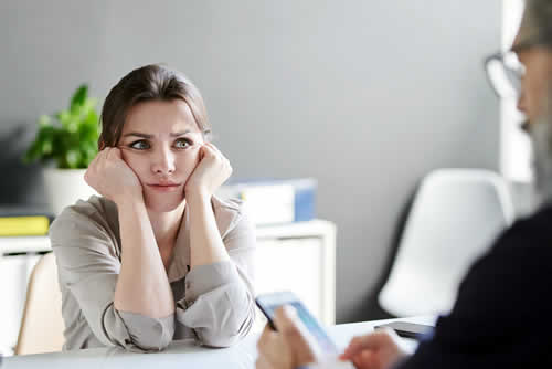 Woman in meeting with team leader